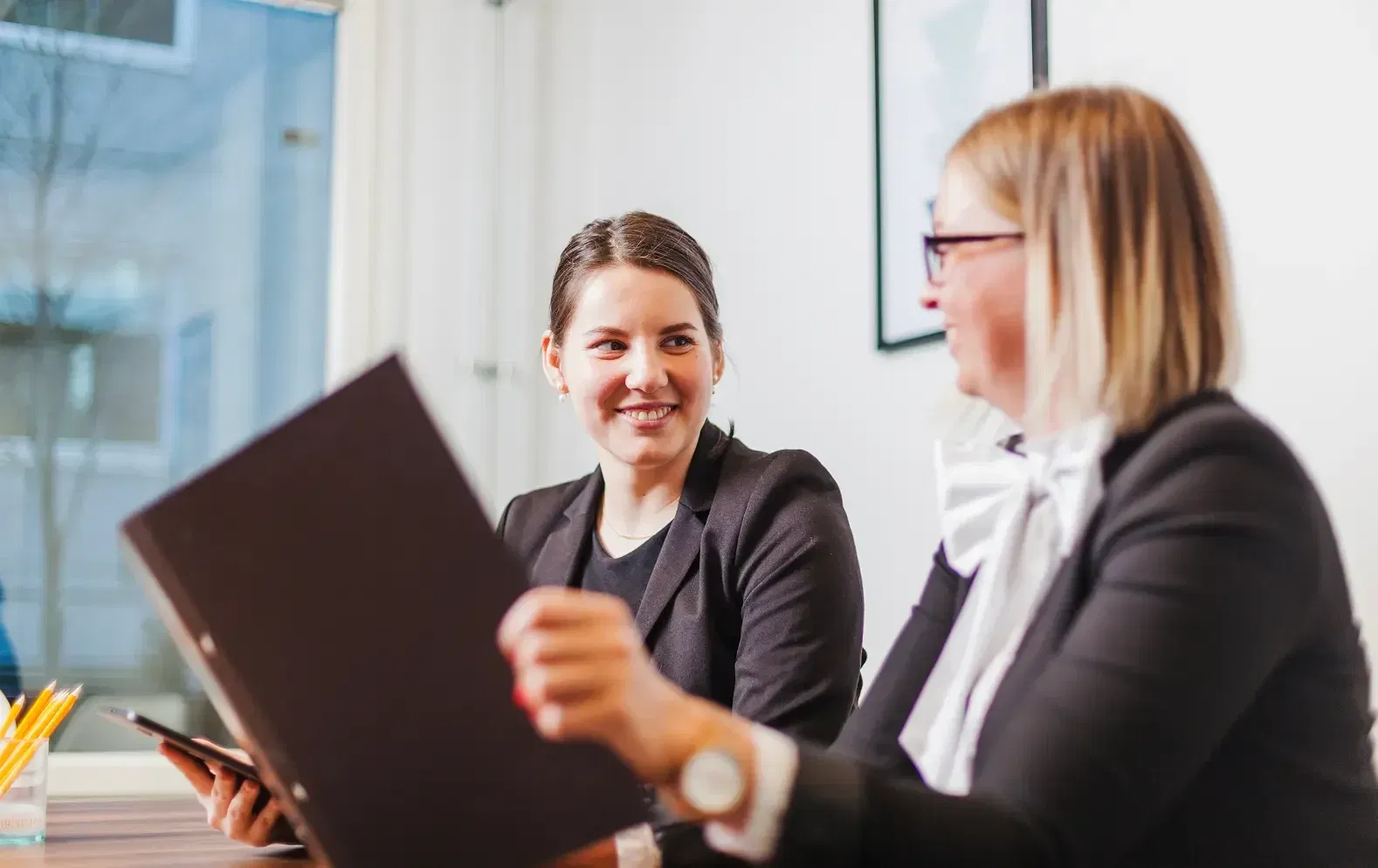 legal team meeting to discuss client work and organize daily schedules